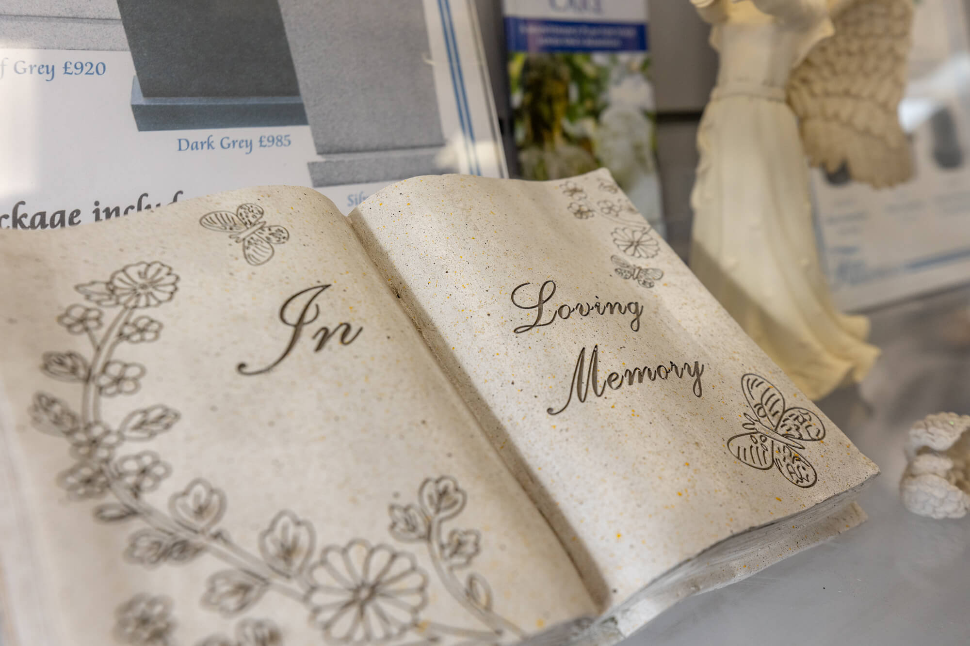 Stone carved book on stand memorial in our Exeter Fine Memorials Showroom, memorial stone masons headstones, cremation memorials, showroom interior, 11 heavitree road in December 2024